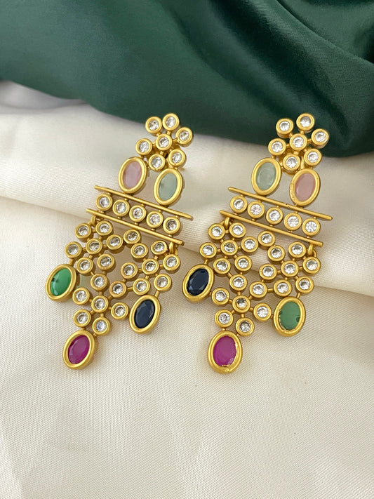 A pair of gold chandelier earrings adorned with multicolored gemstones and clear crystals.