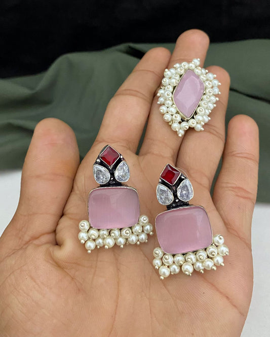 Elegant oxidized earring and finger ring combo with pink stones, red accents, and pearl detailing.